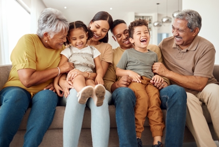 big, happy family sitting on a couch