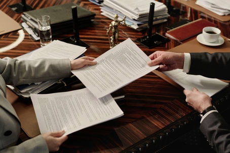 client and lawyer exchanging documents