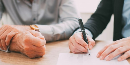 people signing trust documents