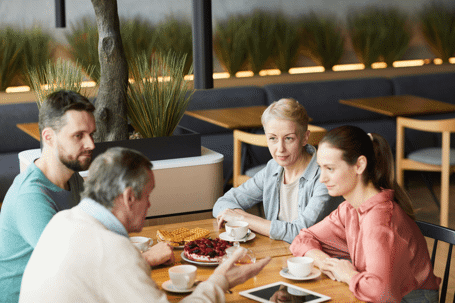 family talking at dinner table